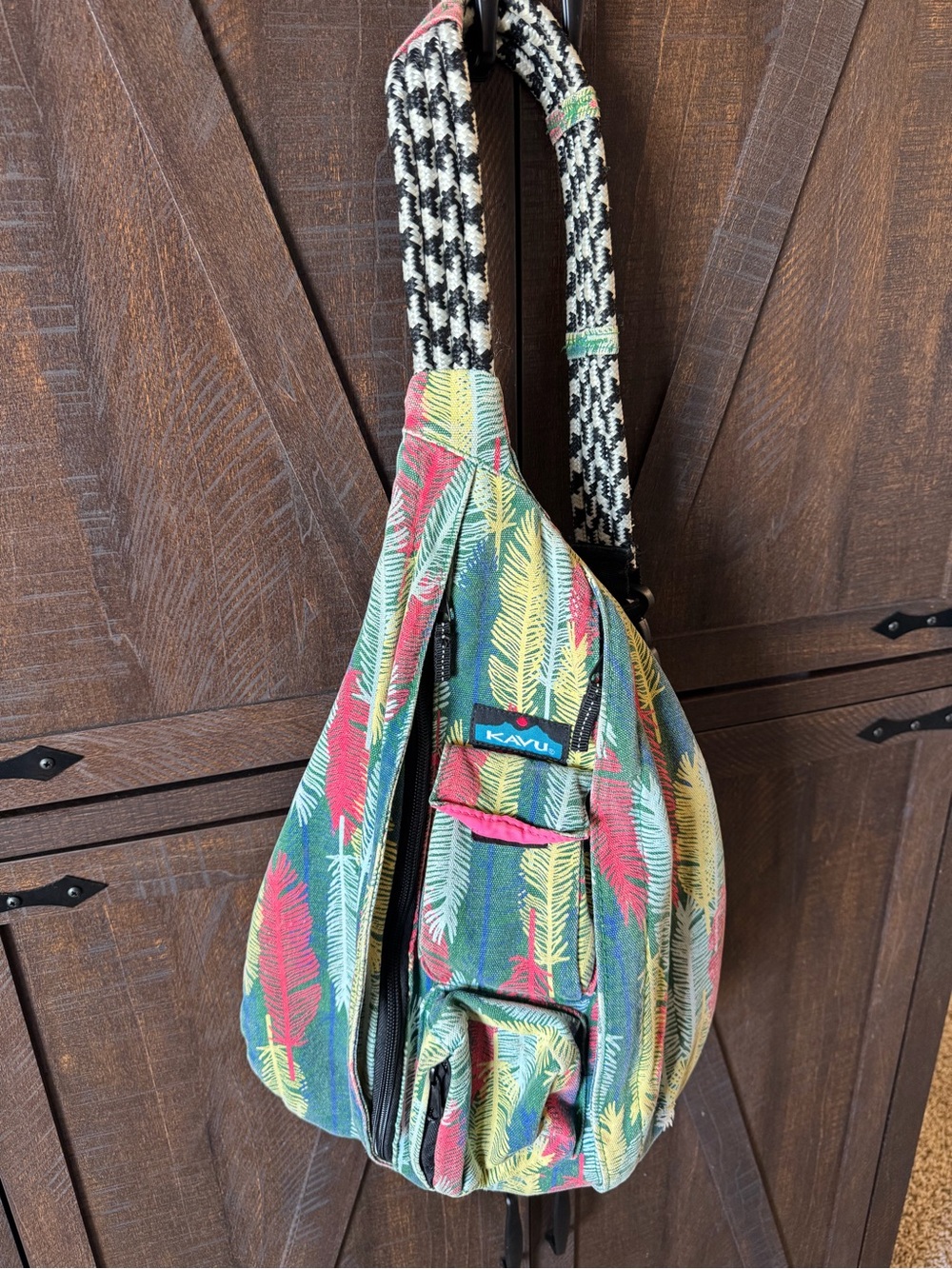 Kavu Feather Print Sling Bag in Green, Red, Yellow
